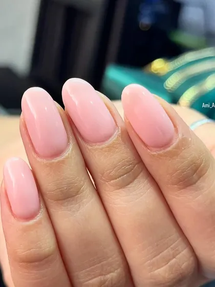 A clean and simple set of sheer pink nails, perfect for an everyday look.