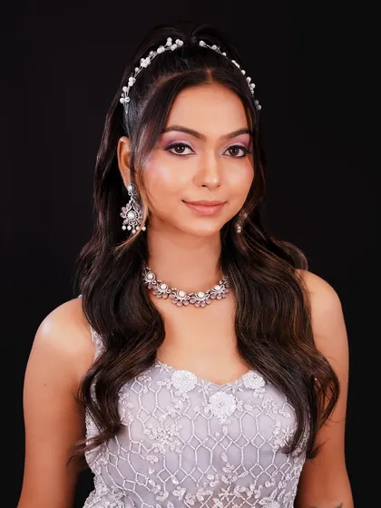 This soft, romantic look with a pearl headband is perfect for an engagement or reception. I teach a range of styles to suit any occasion.