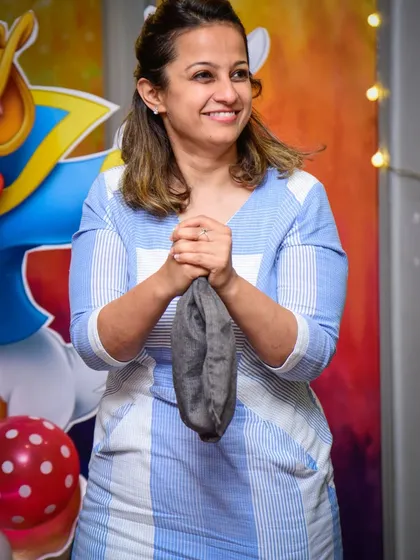 A smile of satisfaction after a successful magic trick.
