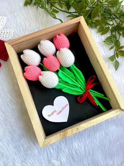 I am so excited to offer these beautiful framed flower arrangements. This piece features a lovely bunch of pink and white crochet tulips, preserved in a solid wooden shadow box. It's a unique piece of wall art that turns my crochet flowers into a forever keepsake.