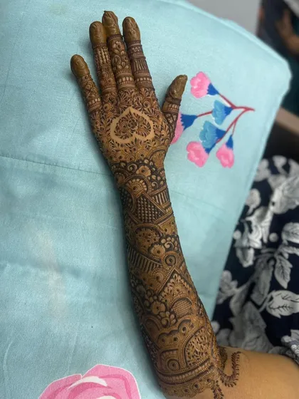 The back of the hand, featuring another heart design. I can place these personal touches wherever you like.