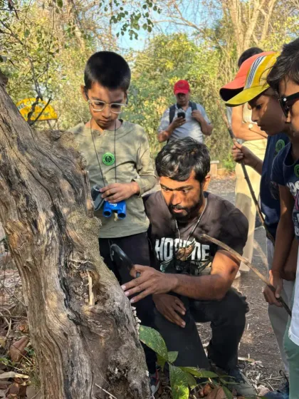 Our expert naturalists are always there to point out hidden wonders, like this one during our Mother's Day forest trail. Learning happens at every step of the journey.