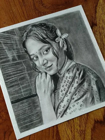 A beautiful portrait of a woman in traditional dress with a flower in her hair, creating a very artistic feel.