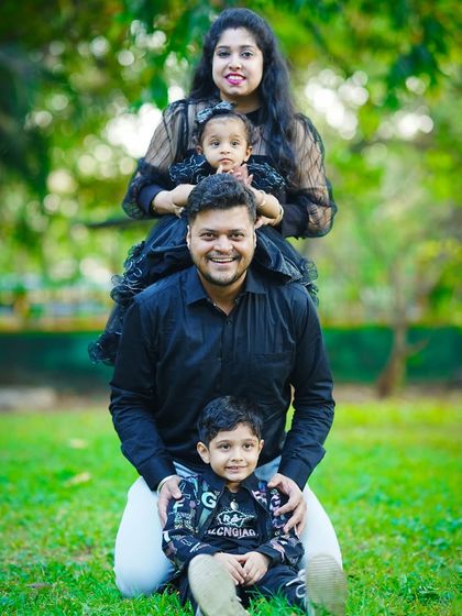 A creative and fun family stack portrait, with everyone lined up in a row for a unique and memorable photo.