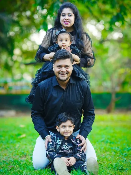 A creative and fun family stack portrait, with everyone lined up in a row for a unique and memorable photo.