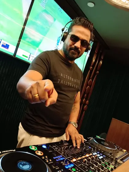 My goal is to give you a helping hand, not just point out mistakes. Here I am behind the Pioneer DJ console, ready to guide you on your journey. This is more than a class; it's a partnership.