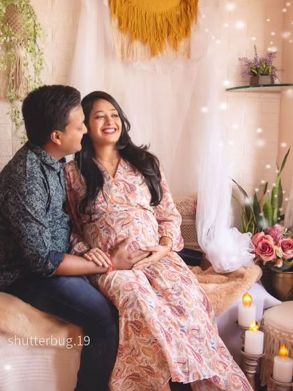 A bright and airy shot of the couple in our bohemian setup. The magical light effects and their happy smiles capture the enchanting feeling of waiting for their little one.