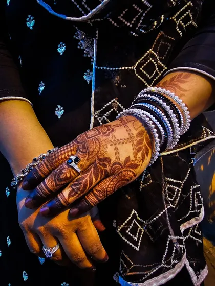 A beautiful shot of the mature stain, accessorized with black and white bangles.