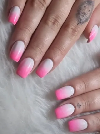 A bold pink and white ombré on square-shaped nails, perfect for a bright and confident look.