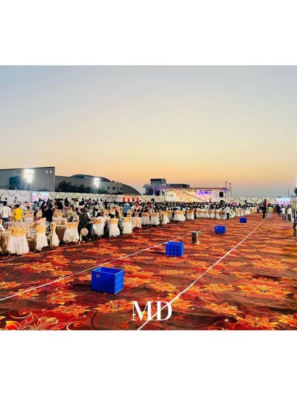 A view of the extensive guest dining and seating area at a large-scale wedding. Our planning ensures smooth flow and a comfortable experience, even with thousands of attendees.