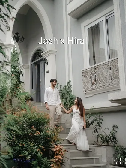 The couple descending the steps of a beautiful Goan villa. This image feels like a scene from a movie, capturing the elegance of the location and the romance of the moment.