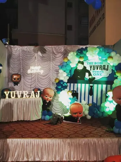 Another angle of the outdoor Boss Baby stage, highlighting the character cutouts and name display.