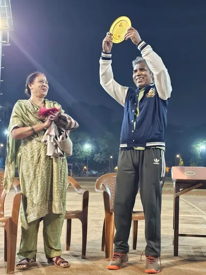 We honor the legends who built this community. A senior member of Chembur YMCA being celebrated on court, a moment of respect for his guidance and support.
