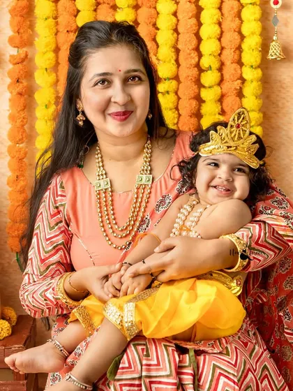 All smiles with mother and child. The joy and connection are evident in this beautiful portrait from a Janmashtami family session.