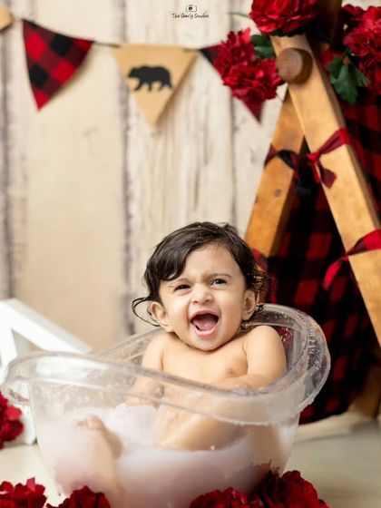Pure joy and laughter during a playful milk bath session.