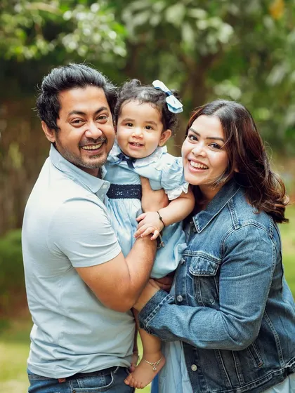 A happy family of three enjoying a day out. Outdoor sessions allow for natural, relaxed portraits that capture genuine emotion.