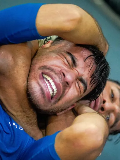 The face of determination. A student fights off a choke during a tough grappling round, embodying the grit and resilience we cultivate in our athletes.