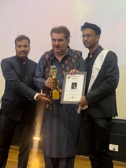 The official award photo. Holding the trophy and certificate is a proud moment.
