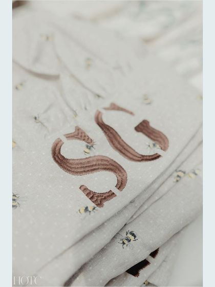 A close-up of the custom-printed aprons for the pizza party, another small detail that makes a big impact.