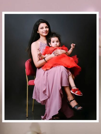 A mother and daughter, a bond of pure love. This elegant studio portrait captures a quiet, loving moment between a mom and her little girl.