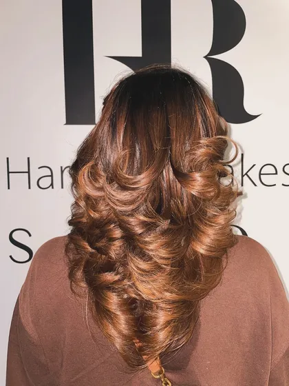 A stunning example of a global color with a layered blowout. The copper-brown shade is vibrant and full of shine.