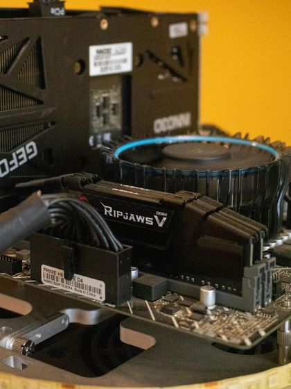 A close-up of a gaming PC motherboard from our "Build a PC" workshop. Kids get to see the intricate components like RAM sticks and heat sinks up close.