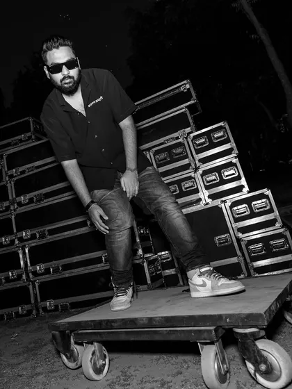 'They see me rollin'... They hatin''. A fun, candid shot backstage with the roadie cases. The hustle behind the scenes is part of the journey.