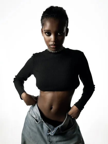 This is a clean, high-key studio portrait from a model's test shoot. It shows my ability to create crisp, professional images with simple lighting that focuses entirely on the subject's features and form, ideal for portfolios and minimalist brands.