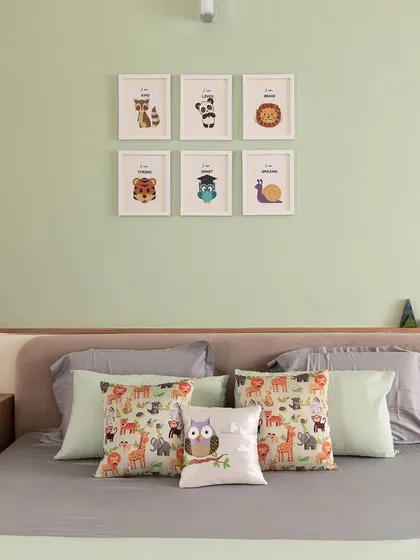 The kid's bedroom in 'A Walk in the Clouds' features a queen-size bed with an upholstered headboard, set against a pastel green wall.