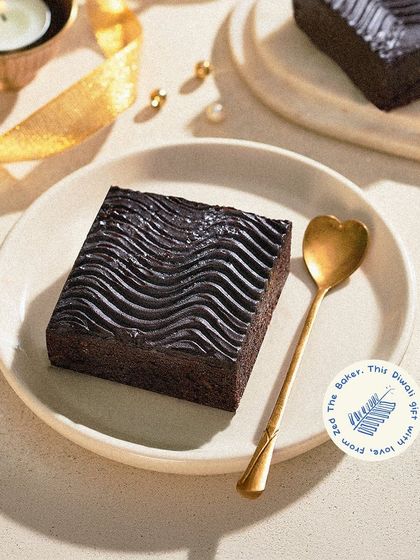 A special edition brownie for Diwali, with a wavy, textured dark chocolate topping that is both elegant and delicious.