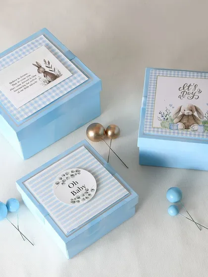 Our return favor hampers come in various styles. These elegant blue boxes were created for a baby boy's announcement, with three different curated options for guests to choose from.
