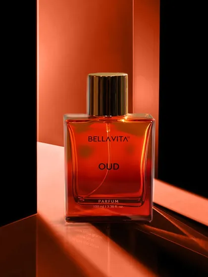 A highly stylized shot of a perfume bottle using reflective surfaces and dramatic lighting. This abstract and artistic approach is ideal for high-end advertising and brand campaigns.