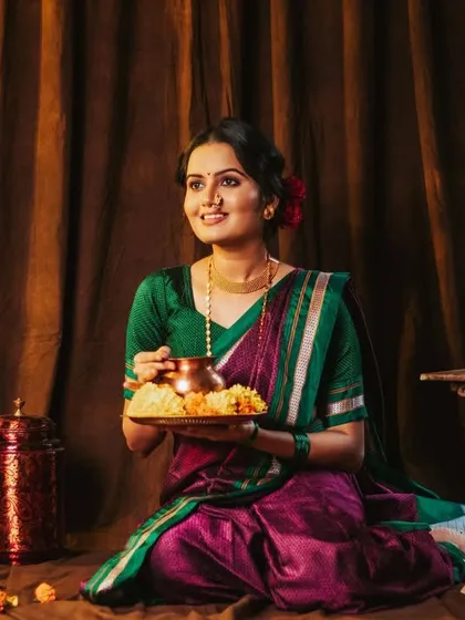 A candid-style shot, as if offering prasad. This tells a story and feels very authentic.
