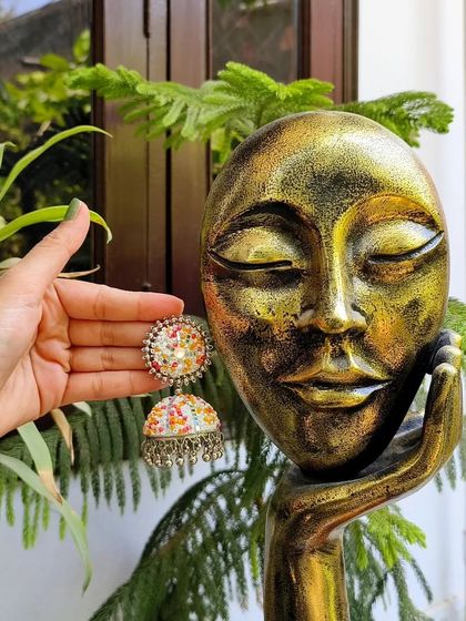 A vibrant, multicolour oxidised jhumka with beautiful enamel work, perfect for Navratri or other colourful festivals.