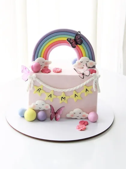 Halfway to a year older! A sweet rainbow and butterfly-themed cake to celebrate a 6-month milestone.