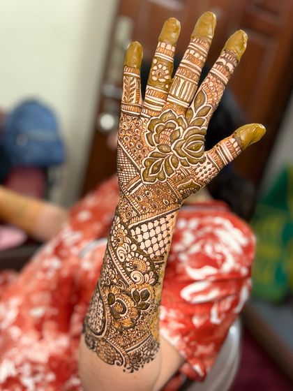 A full-arm design with a mix of bold florals and intricate filler patterns.