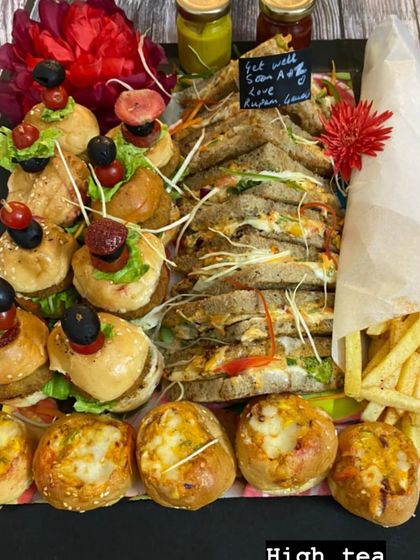 Our high-tea sandwich and burger platter is perfect for casual events. It includes mini burgers, assorted sandwiches, cheese-stuffed buns, and a side of french fries.