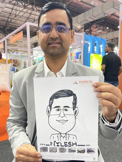 A professionally dressed attendee with his caricature from an exhibition event. This is a great example of a unique corporate giveaway.