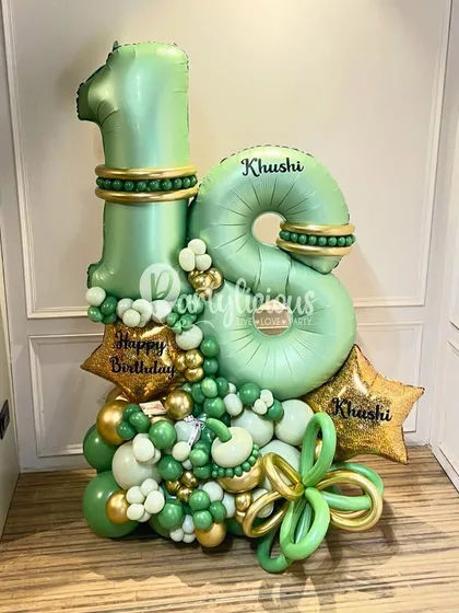 A gorgeous 18th birthday bouquet in shades of sage green and gold. We can personalize the balloons with names and create a lush, organic arrangement that feels both celebratory and incredibly stylish.
