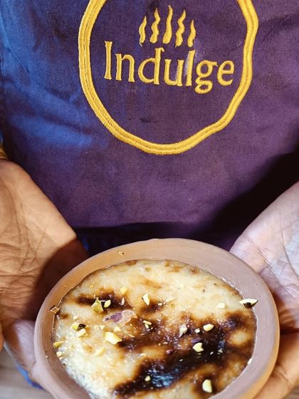 Holding up my creation, the Baked Phirni. It represents my food philosophy: rooted in Indian tastes but open to global techniques and ideas.