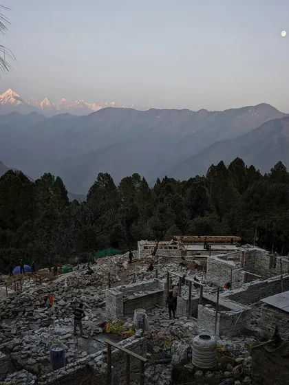 The moon rises over the construction site in Uttarakhand, with the silhouette of the Himalayas in the background. Our work continues from dawn until dusk to make the most of the favorable weather.