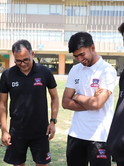 Our coaching staff sharing a light moment during a break in training.