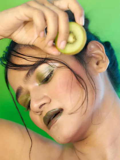 A serene and artistic pose for a beauty editorial or skincare ad. The focus on glowing skin and unique makeup shows my range in beauty modeling.