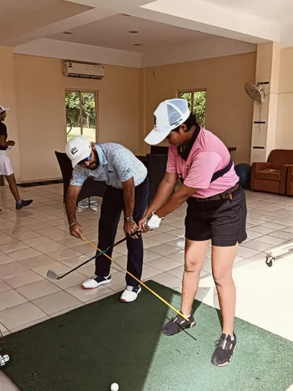 Using a training aid to help a player feel the correct arm structure and connection.