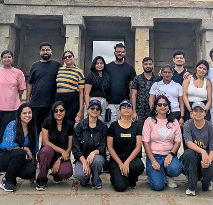 A group photo in front of an ancient temple structure. My trips are designed to be fun, social, and educational.
