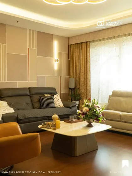 Inspired by Korean minimalism, this living and dining area uses a calm, neutral palette with clean lines and geometric patterns on the wall. The focus is on creating a serene and uncluttered environment with sophisticated lighting.