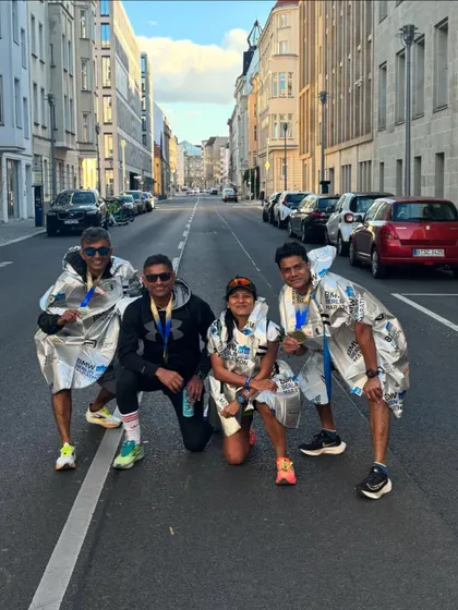 Our runners wrapped in finisher ponchos after the BMW Berlin Marathon. A great performance from the team in Germany.