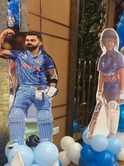 Life-sized cutouts of cricket stars like Virat Kohli alongside the birthday boy make for amazing photo opportunities at a cricket-themed party.