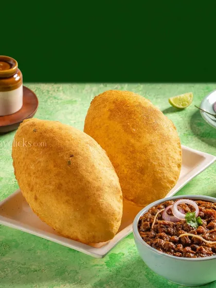 Chole Bhature from Gulab Sweets, with fluffy bhaturas and a side of spicy chickpeas.