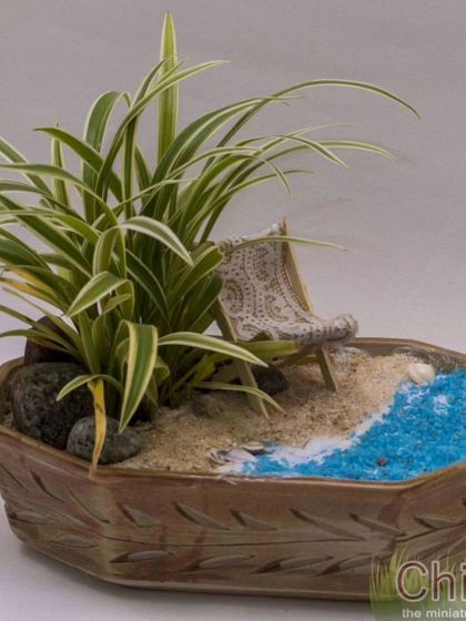 Another one of my early minigardens, this one with a cozy armchair for relaxing by the shore. It's lovely to look back at these.